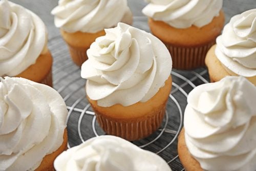 Vanilla frosting on vanilla cupcakes